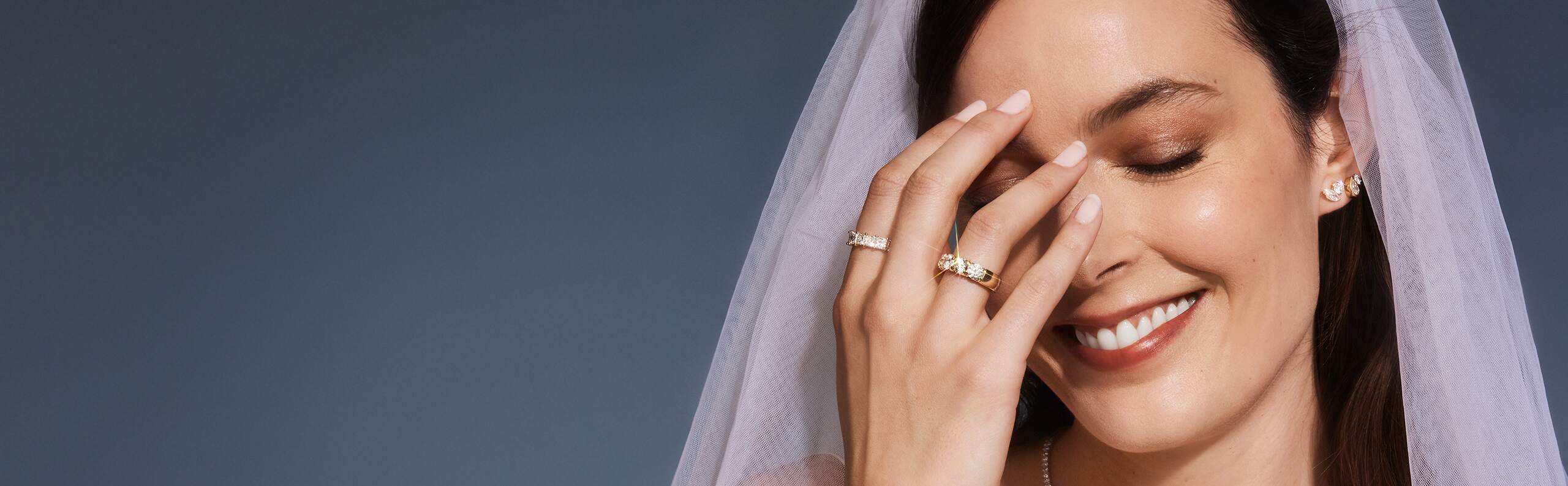 A bride shows off her diamond jewelry